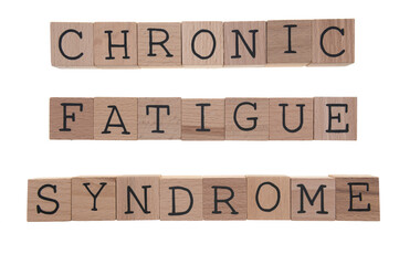 Chronic Fatigue Syndrome spelt with wooden blocks on a white background