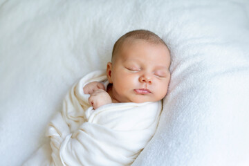 Sweet beautiful baby girl, sleeping in bed with teddy bear, pure colors, infant sleeping 