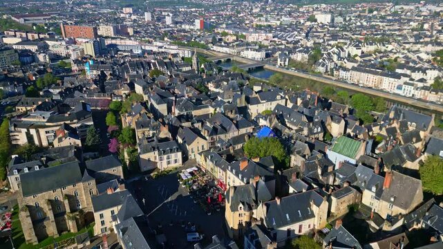 Old Le Mans, Sarthe river, and Eglise St Benoit in background, cityscape, France. Aerial forward