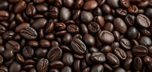 Fototapeta premium Close-up of dark roasted coffee beans, rich brown tones, on black background, black, organic