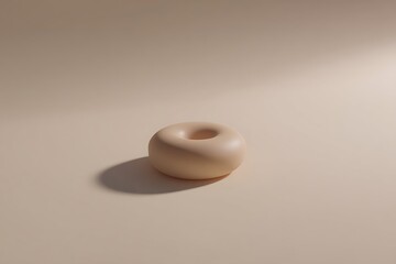 Minimalist beige torus with soft lighting