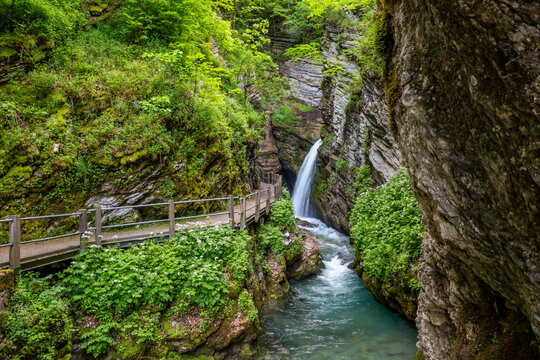 Thur waterfall by footpath in forest