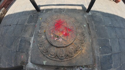 Sacred Star Symbol Engraved on Ancient Stone Slab in Temple Courtyard, Nepal