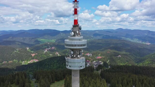 Aerial view to telecommunications tower at Snezhanka peak, in winter resort Pamporovo, Bulgaria in Rhodope mountains