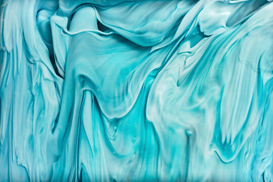 Abstract ocean wave patterns with flowing wavy inks in resin