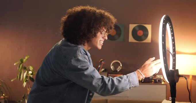 Recording, ring light or man with dancing in home at night for social media, tutorial or routine. Content creation, influencer and live streaming for dancer challenge, online audition and performance