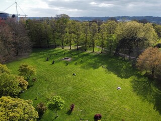 Cardiff, UK - 21 April 2024:  Aerial view of the Cardiff Gorsedd Stone Circle surrounded by lush...
