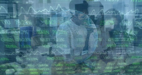 Image of financial data and graphs over diverse coworkers in office