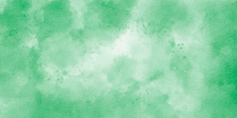 Watercolor grunge background with green paint. Green grunge background with copy space. Green watercolour background paper texture.