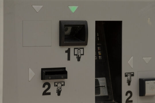 This image provides a detailed closeup view of a parking meter, showcasing its various payment options which include a convenient card reader along with an interactive user display system