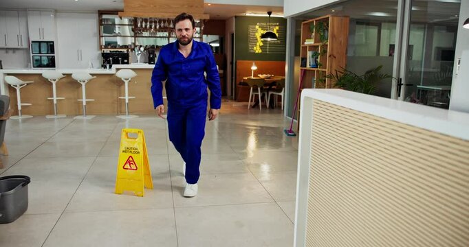 Janitor, accident and man fall in office with workplace safety, ignore warning sign and negligence. Danger, hazard and cleaner slipping on wet floor for workers compensation, mistake and legal claim