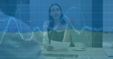 Image of financial data processing and flag of usa over diverse business people in office