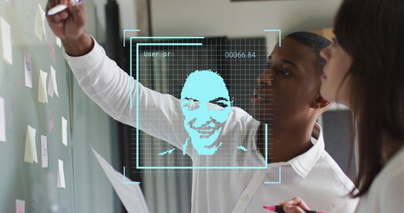 Image of people icons over diverse business people in office