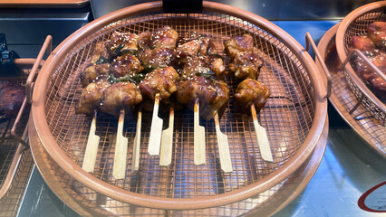 Korean grilled chicken skewers, known as 