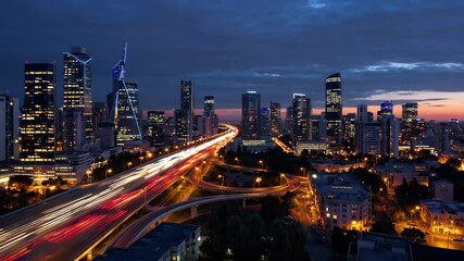 Cinematic night cityscape with glowing skyline and light trails from traffic, symbolizing urban speed, modern lifestyle and vibrant metropolitan energy - Powered by Adobe