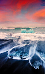 Blocks of ice washed by the waves on Jokulsarlon beach