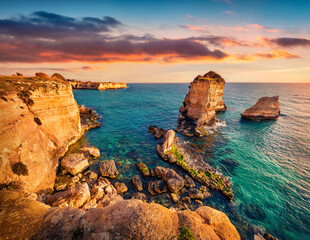 Fantastic summer sunrise on popular tourist attraction - Torre Sant'Andrea. Wonderful morning seascape of Adriatic sea, Torre Sant'Andrea village location, Apulia region, Italy, Europe.