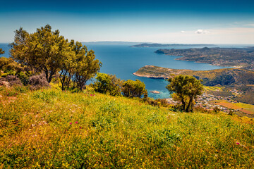 Sunny morning view of Porto Rafti town. Colorful summer  seascape of Aegean sea. Bright outdoor scene of the Greece, Europe. Beauty of nature concept background.