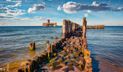 Spectacular summer view of ruins of Gdynia Babie Doly - central facility of German torpedo research centers, built in World War II, Kosakowo resort location. Impressive morning seascape of Bultic sea.