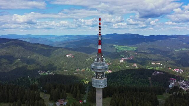 Aerial view to telecommunications tower at Snezhanka peak, in winter resort Pamporovo, Bulgaria in Rhodope mountains