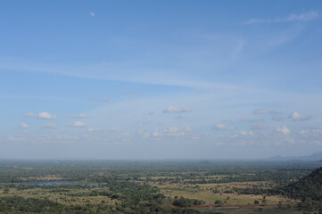 Beautiful natural green landscape from Mihintale mountain peak near Anuradhapura city in Sri Lanka in the afternoon with blue sky