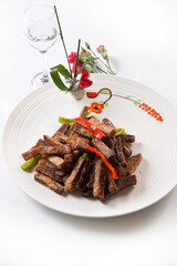 Fried donkey meat with bell peppers