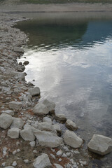 Rocky Lakeshore with Calm Reflective Water
