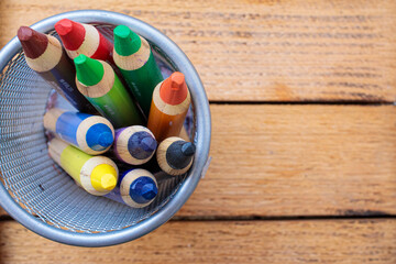 Colored pencils on a wooden background. background for inscriptions. School. September 1. Office....