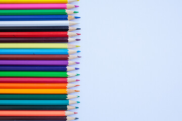 Colored pencils on a white background. background for inscriptions. School. September 1. Office....