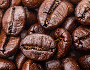 Closeup reveals intricate details of coffee beans, showcasing their dark brown skins and rich textures