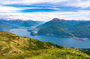 Panorama of Lake Como, showing the towns and mountains above it, photographed at Alpe Palù, in the mountains of Cremia,