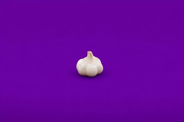 Garlic isolated against a purple background