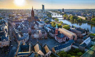 Elevated summer sunrise view of the old town Roemer (Römerberg) in Frankfurt, Germany, until river Main