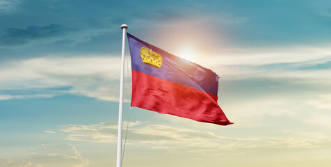 Liechtenstein national flag waving in beautiful sky with mast. A proud moment flag waving with...