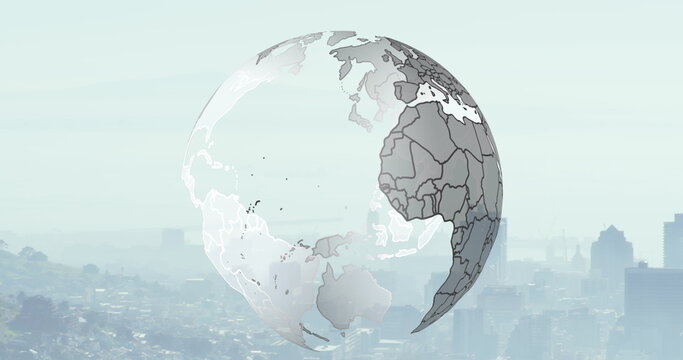 Image of spinning globe over cityscape - Powered by Adobe