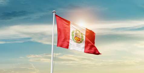 Peru national flag waving in beautiful sky with mast. A proud moment flag waving with sunlight.