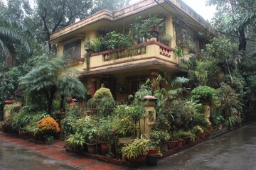 Fototapeta premium Vibrant garden surrounds a charming house in a rain-soaked neighborhood in the early morning hours