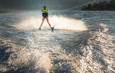 young woman water skiing on a sea.