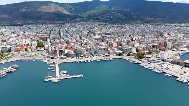 Panoramic aerial view of the skyline of Volos, Greece, with new port and marina, ferry terminal and waterfront promenade
