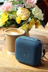 Blue bluetooth speaker on teble
