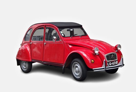 Red Citro&euml;n 2CV parked on a white background