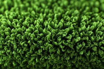Close-up view of lush, green synthetic grass texture suitable for landscaping and home decoration