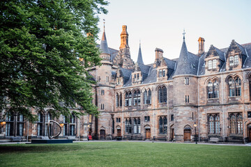 Historic Glasgow University Building with Green Lawn