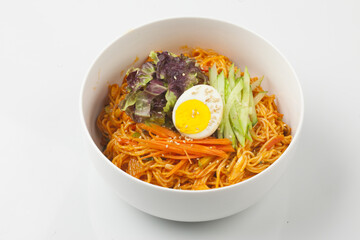 Bibim guksu is a type of noodle dish that is eaten without soup, mixed with meat, vegetables, and various seasonings.