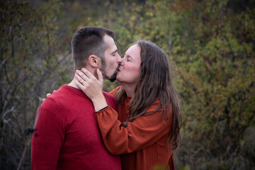 Fototapeta premium happy young couple posing outdoors in autumn