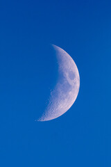 Detailed view of the waxing gibbous Moon against a black night sky. Surface craters and texture are clearly visible in this high-resolution astronomical photo.