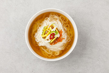  Janchi Guksu refers to noodles that are mainly eaten on feast days. It is a dish made with noodles in a hot clear soup and various toppings.