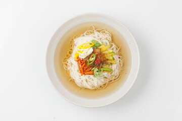  Janchi Guksu refers to noodles that are mainly eaten on feast days. It is a dish made with noodles in a hot clear soup and various toppings.
