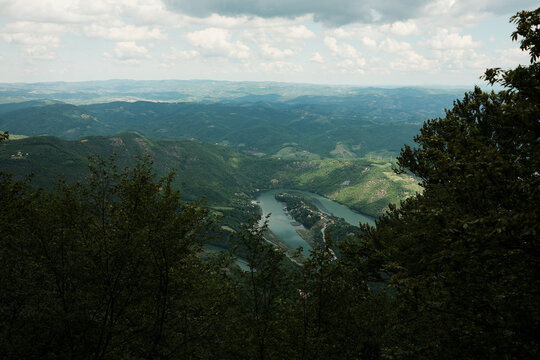 Scenic view of the Morava River meandering through lush green hills from Ovcar mountain, Serbia in spring season.