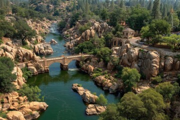 Obraz premium Beautiful rocky river landscape with a historic bridge and lush greenery in a serene setting